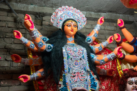 Kolkata, West Bengal, India - 7th October 2018 : Clay idol face of Goddess Durga, with white dress for Durga Puja festival. Biggest festival of Hinduism, celebrated all over the world.のeditorial素材