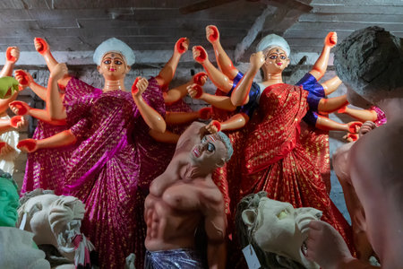 Kolkata, West Bengal, India - 7th October 2018 : Clay idols of Goddess Durga, dresses is sari - a traditional bengali dress - being prepared forのeditorial素材
