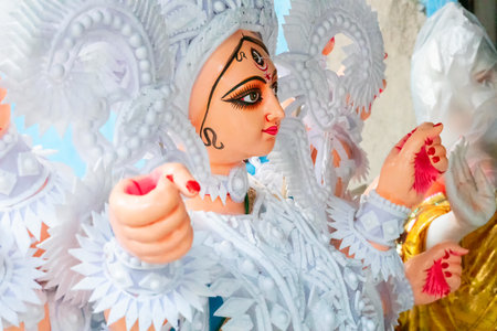 Kolkata, West Bengal, India - 7th October 2018 : Clay idol face of Goddess Durga, with white dress...
