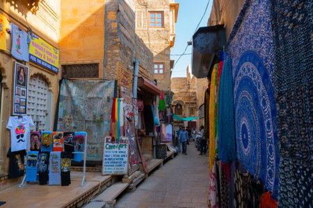 Jaisalmer, Rajasthan, India - October 13, 2019 : Pashmina shawls are being sold in market place Inside Jaisalmer Fort or Golden Fort, in the morning light. UNESCO world heritage site at Thar desert.のeditorial素材