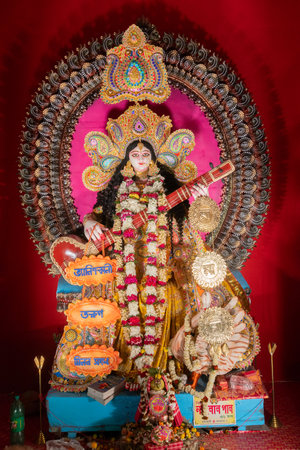 Kolkata,West Bengal,India - 10th February 2019 : Idol of Goddess Saraswati with veena, a musical instrument and white swan, a sacred bird. Hindu goddess of knowledge, music, art, wisdom, and learning.のeditorial素材