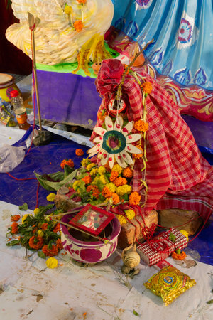 Kolkata,West Bengal,India - 10th February 2019 : Traditional gamchaa, a cotton towel, flowers and other materials are being used to worship Goddess Saraswati at night.のeditorial素材