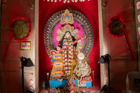 Kolkata,West Bengal,India - 10th February 2019 : Idol of Goddess Saraswati with veena, a musical instrument and white swan, a sacred bird. Hindu goddess of knowledge, music, art, wisdom, and learning.のeditorial素材