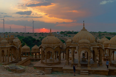 Silhouette of Bada Bagh or Barabagh, with setting sun, is a garden complex in Jaisalmer, Rajasthan, India. A set of royal cenotaphs, or chhatris, of Maharajas of Jaisalmer state. Tourist attraction.のeditorial素材