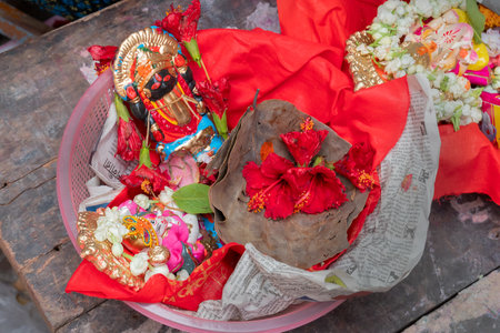 Kalighat, Kolkata, West Bengal, India - April 15th 2019 : God Ganesh and Goddess Kali on red seat are worshipped on auspicious day of Bengali new year. Traditional Bengali Hindu ritual.のeditorial素材