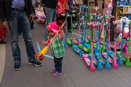 Kolkata, West Bengal, India - 29th December 2019 : Little boy playing with toy in New Market area, Kolkata.のeditorial素材