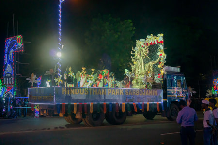 Kolkata, West Bengal, India - 3rd October 2017 : Durga Puja carnival on Red Road at night, all famous Durga idols are passed one by one for roadside devotees to enjoy last days of Durga Puja festival.のeditorial素材