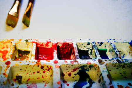 Used watercolour palette and brushes with copyspace. Vibrant colours used on the palette. Shot at Howrah, West Bengal, India.の写真素材