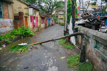 Howrah, West Bengal, India - 21st May 2020 : Super cyclone Amphan broke a roadside tree which fell...