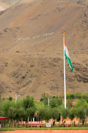 Indian national flag is waving in the bottom of mount Tololing, remembering kargil war of 1999 when Indian army won and fought back Pakistani army out of Indian territory. Kargil, Ladakh, India.の写真素材