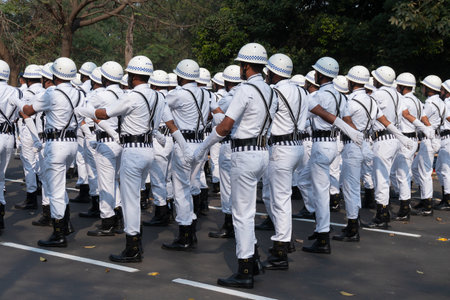 Kolkata, West Bengal, India - 26th January 2020 : Kolkata Police Officers dressed in white are marching past in white dress in morning, India's republic day parade at Red Road.のeditorial素材