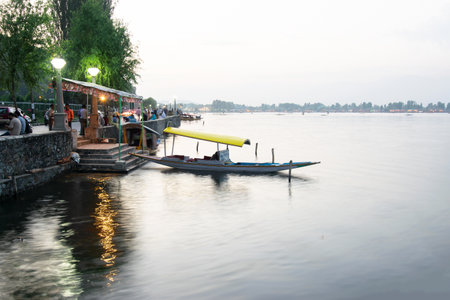 Shree Nagar,Jammu and Kashmir,India- 31st August 2014 : View of beautiful Dal lake, houseboats floating on water with evening sky in the background. A major tourist attraction from all over the world.のeditorial素材