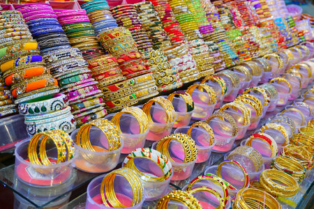 Haridwar, Garhwal, India - 3rd November 2018 : Colourful bangles displayed for sale. Night image of Motibazar, a famous market place for tourists visiting Haridwar.のeditorial素材