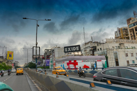 Kolkata, West Bengal, India - 6th August 2019 : Fast moving cars passing AJC Bose road flyover, near exide crossing, busy city traffic of Kolkata road.のeditorial素材