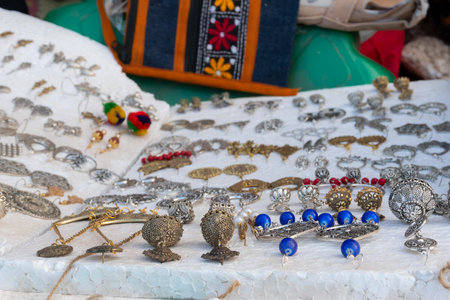 Various shapes and shades of earrings , handicrafts on display during the Handicraft Fair in Kolkata , earlier Calcutta, West Bengal, India. It is the biggest handicrafts fair in Asia.の写真素材
