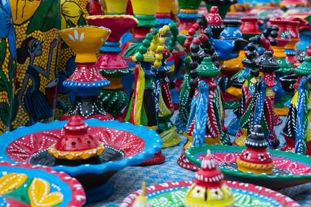 Beautiful painted colorful terracotta pots, works of handicraft, for sale during Handicraft Fair in...