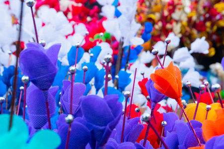 Colorful artificial flowers made out of colored sola, spongewood, handicrafts on display during the Handicraft Fair in Kolkata , West Bengal, India. It is the biggest handicrafts fair in Asia.の写真素材