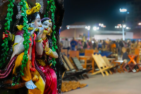 Lord Krishna playing flute and Radha smiling made of terracotta dollsの写真素材