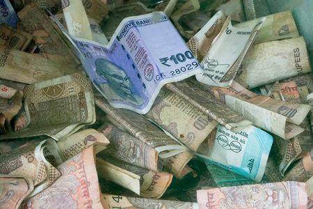 Howrah,West Bengal,India - 7th July 2019 : Money for worshipping, Indian currencies collected inside a box for worshipping God Jagannath, Balaram and Suvodra. Ratha jatra festival.のeditorial素材