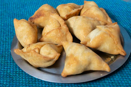 Homemade Samosa, samsa or smosa. A vegetarian spicy Indian special traditional street food. Iftaari...