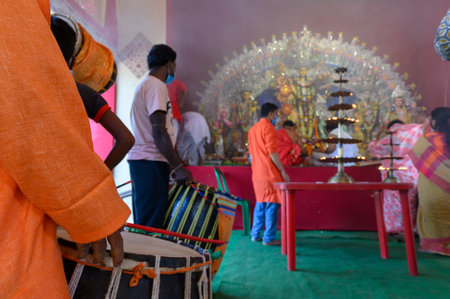 Howrah, West Bengal, India - 25th October 2020 : Dhaaks are played while Goddess Durga is being...