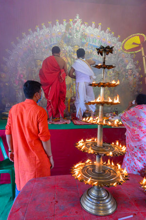 Howrah, West Bengal, India - 25th October 2020 : Goddess Durga is being worshipped by masked Hindu...