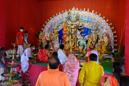 Howrah, West Bengal, India - 25th October 2020 : Goddess Durga is being worshipped by Hindu priests...