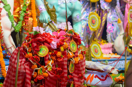 Howrah, West Bengal, India - 24th October 2020 : Sthalpadma, Hibiscus mutabilis, Confederate rose, Dixie rosemallow, cotton rose or cotton rosemallowa flower is being put on representing Durga idol.のeditorial素材