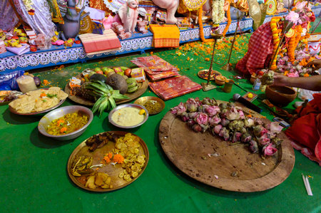 Howrah, West Bengal,India - 25th October 2020 : Various fruits, bengali foods, flowers, sweets and saris, are offered to Goddess Durga , being worshipped during Durga puja. The biggest Hindu festival.のeditorial素材