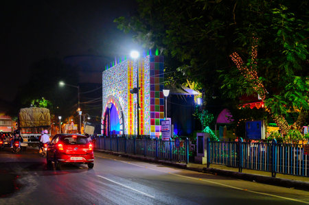 Kolkata, West Bengal, India - 23rd October, 2020 : Decorated Durga Puja pandal at night, beside street of Kolkata. Biggest festival of Hinduism celebrated all over the world.のeditorial素材