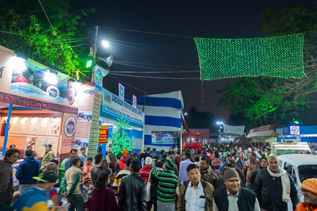 Kolkata, West Bengal, India - 12th January 2020 : Devotees walking in the evening at Gangasagar transit camp to visit Hindu sadhus at their camps , at Babughat, Kolkata.のeditorial素材