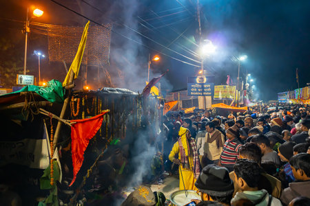 Kolkata, West Bengal, India - 12th January 2020 : Gathering of Indian Hindu Sadhus at their tents, Gangasagar transit camp. Shot at colored light in winter night.のeditorial素材