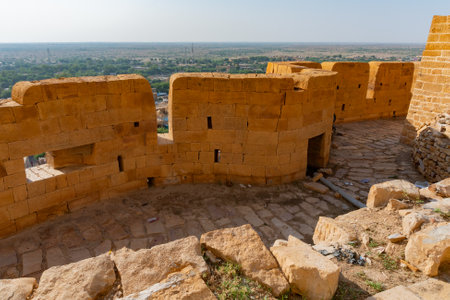 Jaisalmer, Rajasthan, India - October 13,2019 : Great walls of Jaisalmer Fort or Golden Fort, made of yellow sandstone, in the morning light with part of city in the frame. UNESCO world heritage site.のeditorial素材