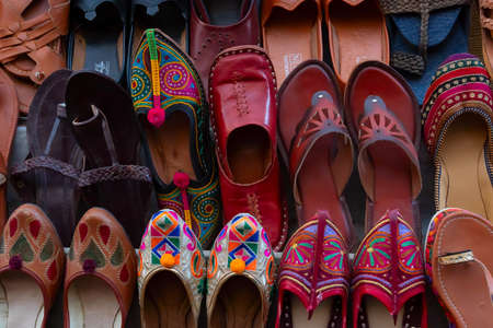Pairs of Rajasthani womens' shoes at display for sale. Jaisalmer, Rajasthan, India.の写真素材