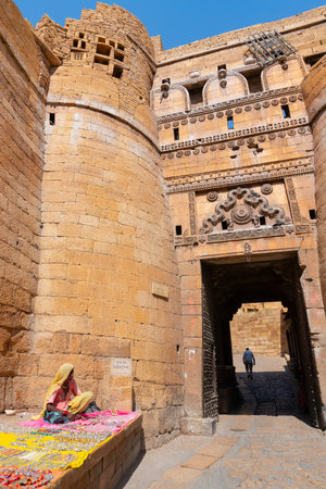 Jaisalmer, Rajasthan, India - October 13, 2019 : Rajasthani woman selling jewelleries in gate and market place Inside Jaisalmer Fort . Popular tourist market place.のeditorial素材