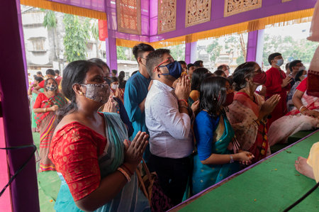 Howrah, West Bengal, India - 14th October 2021 : Hindu devotees offering pushpanjali to Goddess...