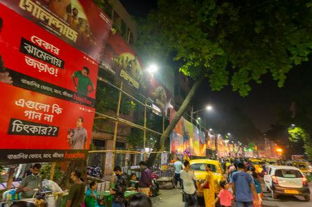 Kolkata, West Bengal, India - 12th October 2021 : Traditional Durga Puja at city of joy, UNESCO Intangible cultural heritage of humanity. Devotees rushing to visit famous Puja pandal at night.のeditorial素材