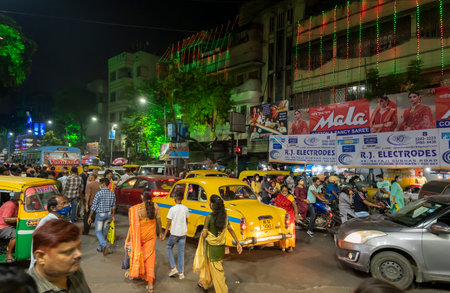 Kolkata, West Bengal, India - 12th October 2021 : Traditional Durga Puja at city of joy, UNESCO Intangible cultural heritage of humanity. Devotees rushing to visit famous Puja pandal at night.のeditorial素材