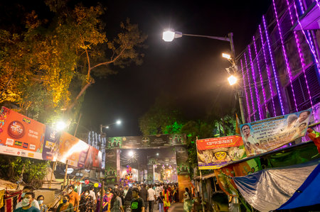 Kolkata, West Bengal, India - 12th October 2021 : Traditional Bagbazar Durga Puja, UNESCO Intangible cultural heritage of humanity. Devotees rushing to visit famous Puja pandal at night.のeditorial素材