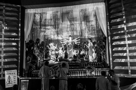 Kolkata, West Bengal, India - 12th October 2021 : Durga Puja, UNESCO Intangible cultural heritage of humanity. Devotees visiting decorated Durga Puja pandal at night.のeditorial素材