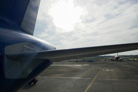 Kolkata, West Bengal, India - 23rd July 2019 : Indigo flight is ready for departure at Kolkata air port. Flight runway of Netaji Subhas Chandra Bose International Airport. Sun rise background.のeditorial素材