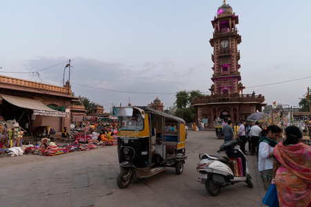 Jodhpur, Rajasthan, India - 20.10.2019 : Autorickshaws running at busy and congested famous Sardar Market and Ghanta ghar Clock tower in Jodhpur, Rajasthan, India.のeditorial素材