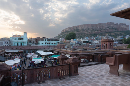 Jodhpur, Rajasthan, India - 16.10.2019 : View from top, famous Sardar Market and Ghanta ghar Clock tower with Mehrangarh fort in background.のeditorial素材