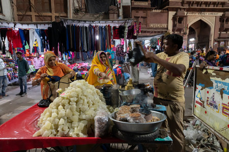 Jodhpur, Rajasthan, India - 20.10.2019 : Kumro methai, Petha , Indian candy is being sold at road side at famous Sardar Market and Ghanta ghar Clock tower market. Petha is a soft translucent Indian candy.のeditorial素材