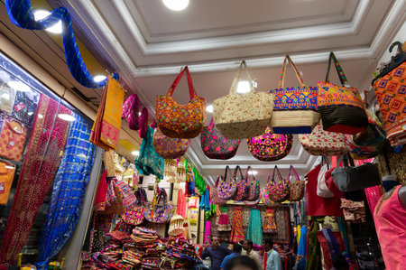Jodhpur, Rajasthan, India - 19.10.2019 : Colorful Rajasthani ladies bags are displayed for sale at famous Sardar Market and Ghanta ghar Clock tower in Jodhpur, Rajasthan, India.のeditorial素材