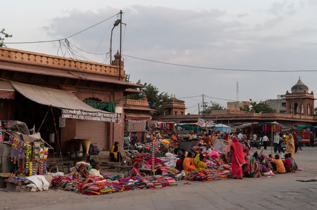 Jodhpur, Rajasthan, India - 20.10.2019 : Rajasthani womens clothes being sold at Famous Sardar Market and Ghanta ghar Clock tower in the evening.のeditorial素材