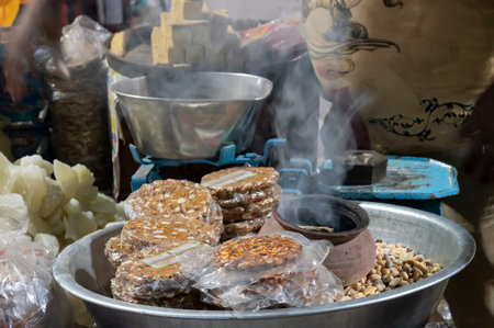 Jodhpur, Rajasthan, India - 20.10.2019 : Badam patali , Indian snacks is being sold at famous Sardar Market and Ghanta ghar Clock tower in Jodhpur, Rajasthan, India.のeditorial素材