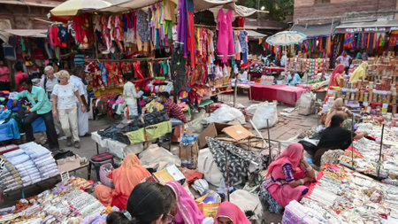 Jodhpur, Rajasthan, India - 20.10.2019 : White necklaces, gold plated earrings and ornaments are being sold to young female customers at famous Sardar Market and Ghanta ghar Clock tower in Jodhpur.のeditorial素材