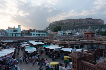 Jodhpur, Rajasthan, India - 16.10.2019 : View from top, famous Sardar Market and Ghanta ghar Clock tower with Mehrangarh fort in background.のeditorial素材