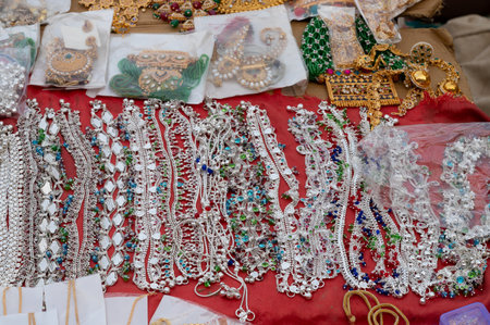 Jodhpur, Rajasthan, India - 20.10.2019 : White necklaces and gold plated earrings are being sold at famous Sardar Market and Ghanta ghar Clock tower in Jodhpur.のeditorial素材